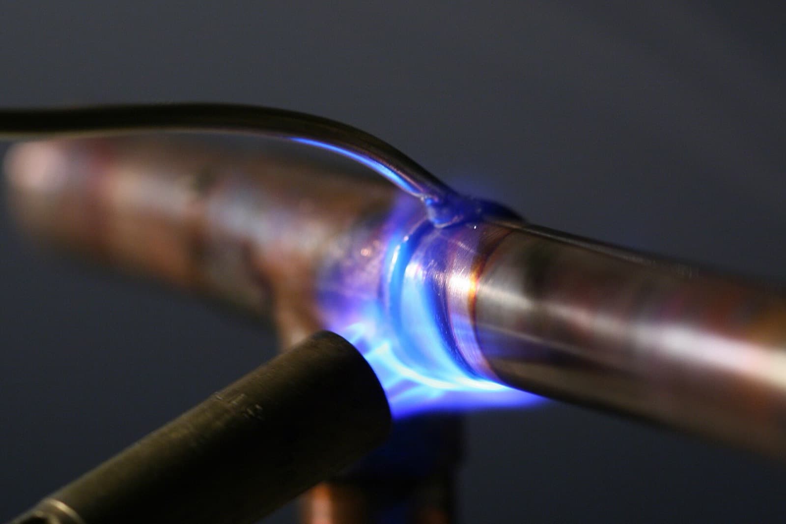 Plumber soldering a copper pipe joint