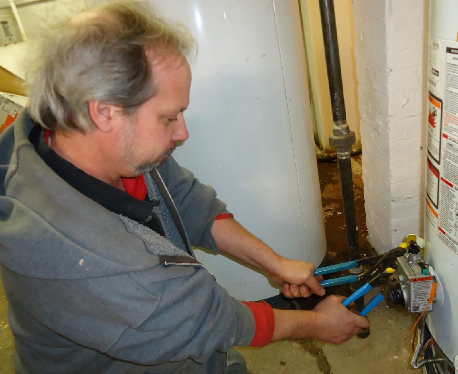 Plumber on a water-heater call